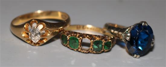 Three gold rings set with paste or synthetic stones,
